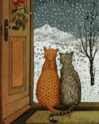 Cats watching snow fall